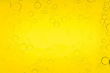 Macro microscope yellow bubble texture, Close-up Yellow bubbles and drops oil background . golden Yellow water bubbles, close up golden oil drop for celebration