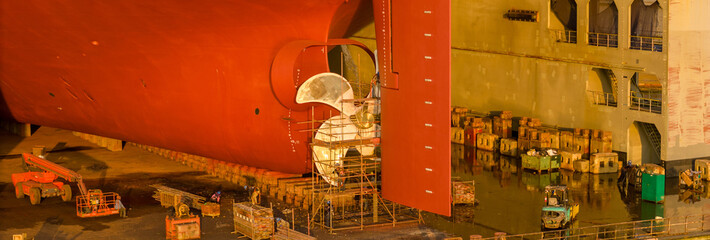 Propeller of large ship spinning power working and water splash contrail . Close up image detail...
