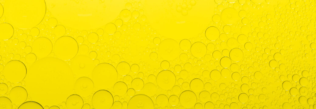 Macro microscope yellow bubble texture, Close-up Yellow bubbles and drops oil background . golden Yellow water bubbles, close up golden oil drop for celebration