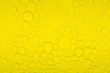 Macro microscope yellow bubble texture, Close-up Yellow bubbles and drops oil background . golden Yellow water bubbles, close up golden oil drop for celebration