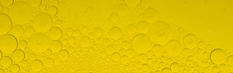 Macro microscope yellow bubble texture, Close-up Yellow bubbles and drops oil background . golden...