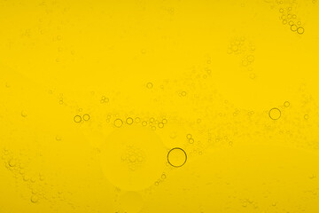 Macro microscope yellow bubble texture, Close-up Yellow bubbles and drops oil background . golden Yellow water bubbles, close up golden oil drop for celebration