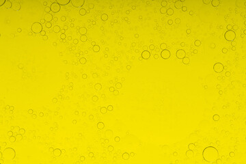 Macro microscope yellow bubble texture, Close-up Yellow bubbles and drops oil background . golden Yellow water bubbles, close up golden oil drop for celebration
