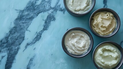 Creamy face masks in small bowls