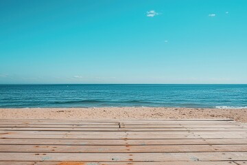 Obraz na płótnie Canvas Wooden floor or plank on sand beach in summer, calm sea and blue sky background