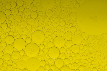 Macro microscope yellow bubble texture, Close-up Yellow bubbles and drops oil background . golden...