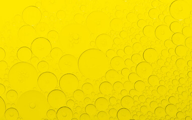 Macro microscope yellow bubble texture, Close-up Yellow bubbles and drops oil background . golden Yellow water bubbles, close up golden oil drop for celebration