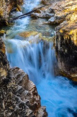 Beautiful clear water flowing through Marble Canyon and travelling over waterfalls 