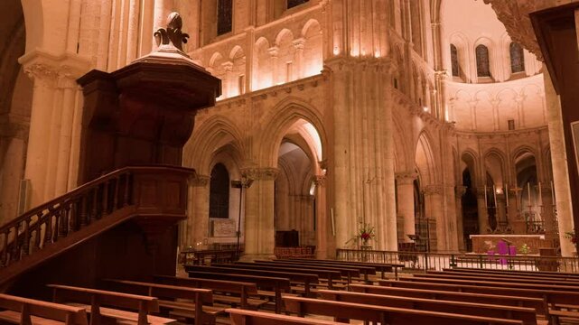 Interior view of Saint-Nicolas Church in Blois, France illuminated with lights. Romanesque style church.