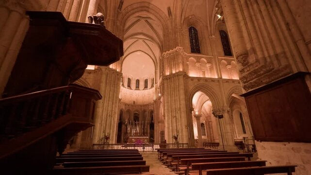 A beautiful Gothic-style church interior, Saint-Nicolas, Blois, France, warm-lit at night