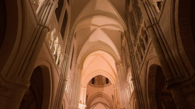 A grand Gothic church interior with towering arches, warm lighting, and sacred ambiance