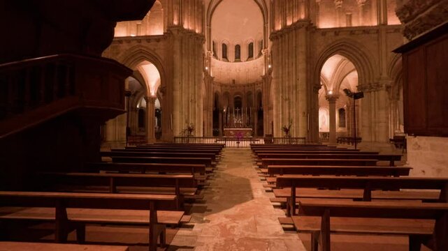 A majestic view of the lit interior of Saint-Nicolas Church in Blois, France at night