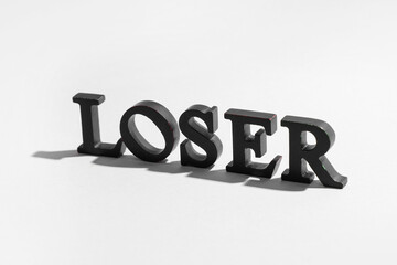 Word LOSER on white background