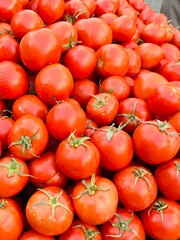 Tomatoes in a supermarket. A lot of red tomato. vegetables
