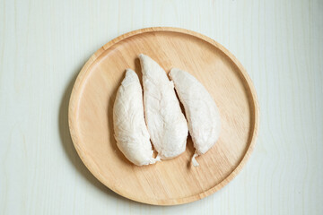 Three large pieces of freeze-dried chicken, preserved as pet snacks.