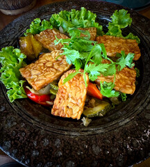 A close up of a vegetarian lunch dish at a Khmer restaurant in Phnom Penh Cambodia - enjoying the flavors of tempeh