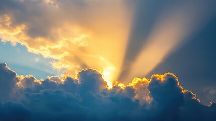 Dramatic sunlight beams piercing through clouds creating a beautiful sky landscape at sunset