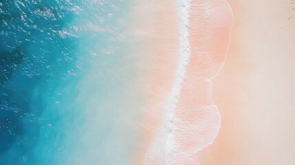 Fototapeta premium Aerial view of a serene white sandy beach with gentle waves and vibrant blue water ideal for minimalist design and ample text space