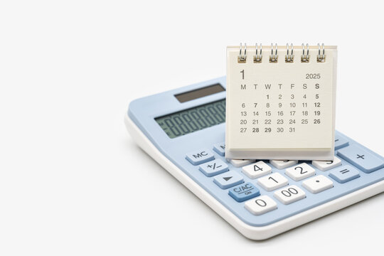 Simple desk calendar for JANUARY 2025 on calculator. Calendar concept with copy space. 2025 JAN calendar. calculator and forecast for finances in 2025. Money, Budget, tax, investment and financial.