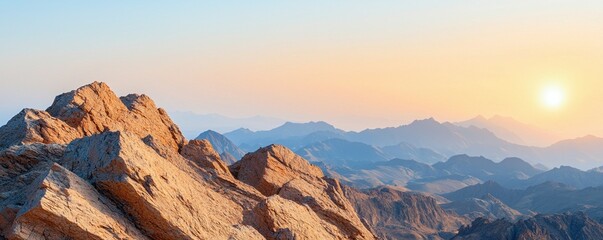 Naklejka premium Simple mountain range concept. Majestic mountain landscape at sunrise with rocky foreground.