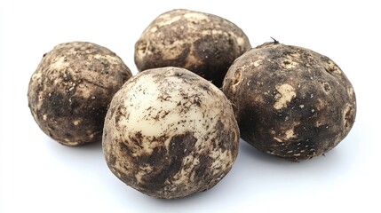 Obraz premium Fresh organic raw potatoes with earthy skin texture displayed on a bright white background for culinary or agricultural purposes