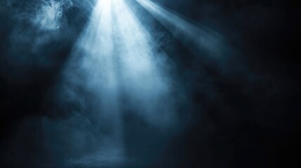 Scenic stage spotlight beams illuminating dark smoky background creating a dramatic atmospheric effect for performances and events