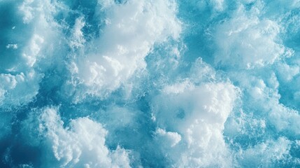 Obraz premium Fluffy white clouds in a serene blue sky creating a tranquil and dreamy nature background ideal for wallpapers and textures.