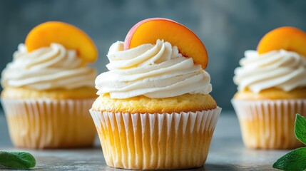 Fresh peach topped yellow cupcake with creamy vanilla frosting on a rustic background