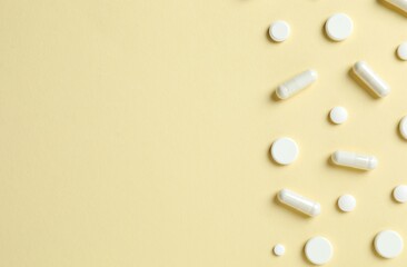 White pills on color background