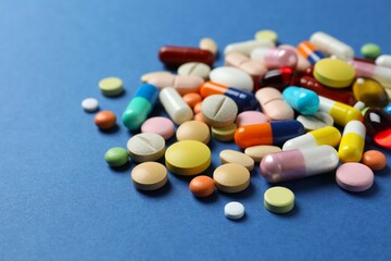 Various pills on color background