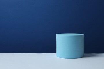 Blue podium on color background 