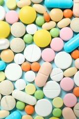Various pills on color background