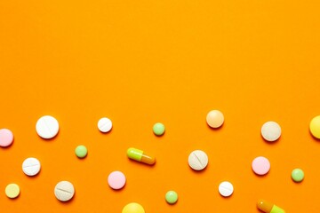 Various pills on color background