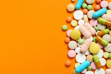 Various pills on color background
