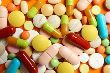 Various pills on color background