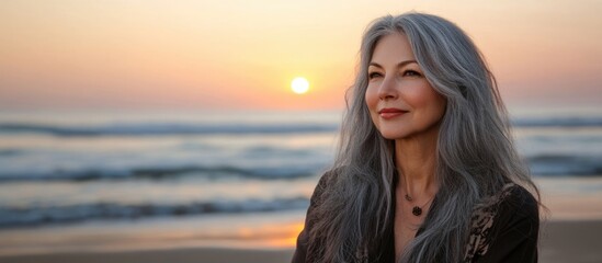 Serene Portrait of Mature Woman with Gray Hair at Sunset on Seaside Beach with Gentle Waves and Expansive Copy Space for Text
