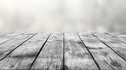 Rustic wooden tabletop with a soft blurred gray kitchen backdrop for versatile design and presentation purposes