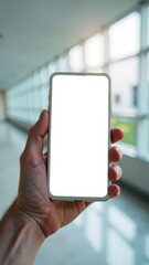 male hand holds smartphone, smartphone has white screen, beautiful sunny white ward background, hospital