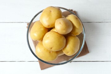 Young potatoes. Fresh potatoes on a wooden background. Harvesting collection. organic, freshly dug potatoes. Agricultural background. Vegan. Vegetables.Place for text.Copy space