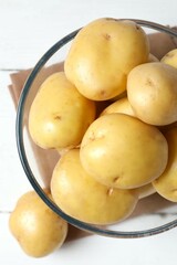 Young potatoes. Fresh potatoes on a wooden background. Harvesting collection. organic, freshly dug potatoes. Agricultural background. Vegan. Vegetables.Place for text.Copy space