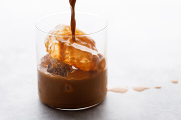 Thai iced tea. Cold drink from Ceylon black tea and milk. Selective focus.