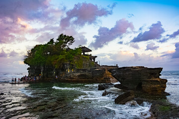 Tanah Lot Temple in Bali, Indonesia; at sunset. Hindu temple.