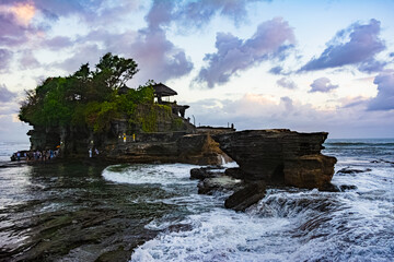 Tanah Lot Temple in Bali, Indonesia; at sunset. Hindu temple.