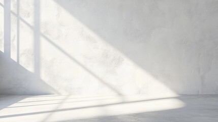 Sunlight streams through window onto textured white wall and floor.