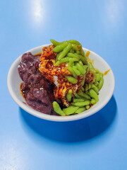 Cendol is a Malaysian dessert made of shaved ice, coconut milk, green pandan jelly noodles, and sweet dark brown sugar syrup. 