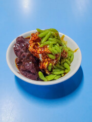 Cendol is a Malaysian dessert made of shaved ice, coconut milk, green pandan jelly noodles, and sweet dark brown sugar syrup. 