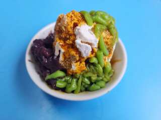 Cendol is a Malaysian dessert made of shaved ice, coconut milk, green pandan jelly noodles, and sweet dark brown sugar syrup. 