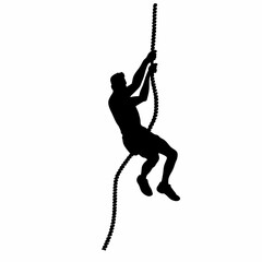 A man is hanging from a rope. He is wearing shorts and a shirt. The rope is tied to a tree