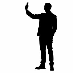 A man is taking a picture of himself with a cell phone. He is wearing a suit and tie