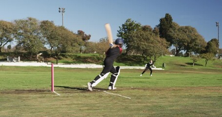 Playing cricket, female athlete running on field during daytime match - Powered by Adobe